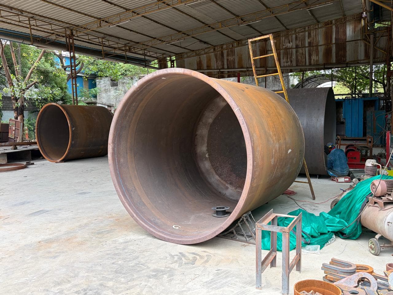 Heavy steel pipe fabrication — large cylindrical components at PAL Structural factory